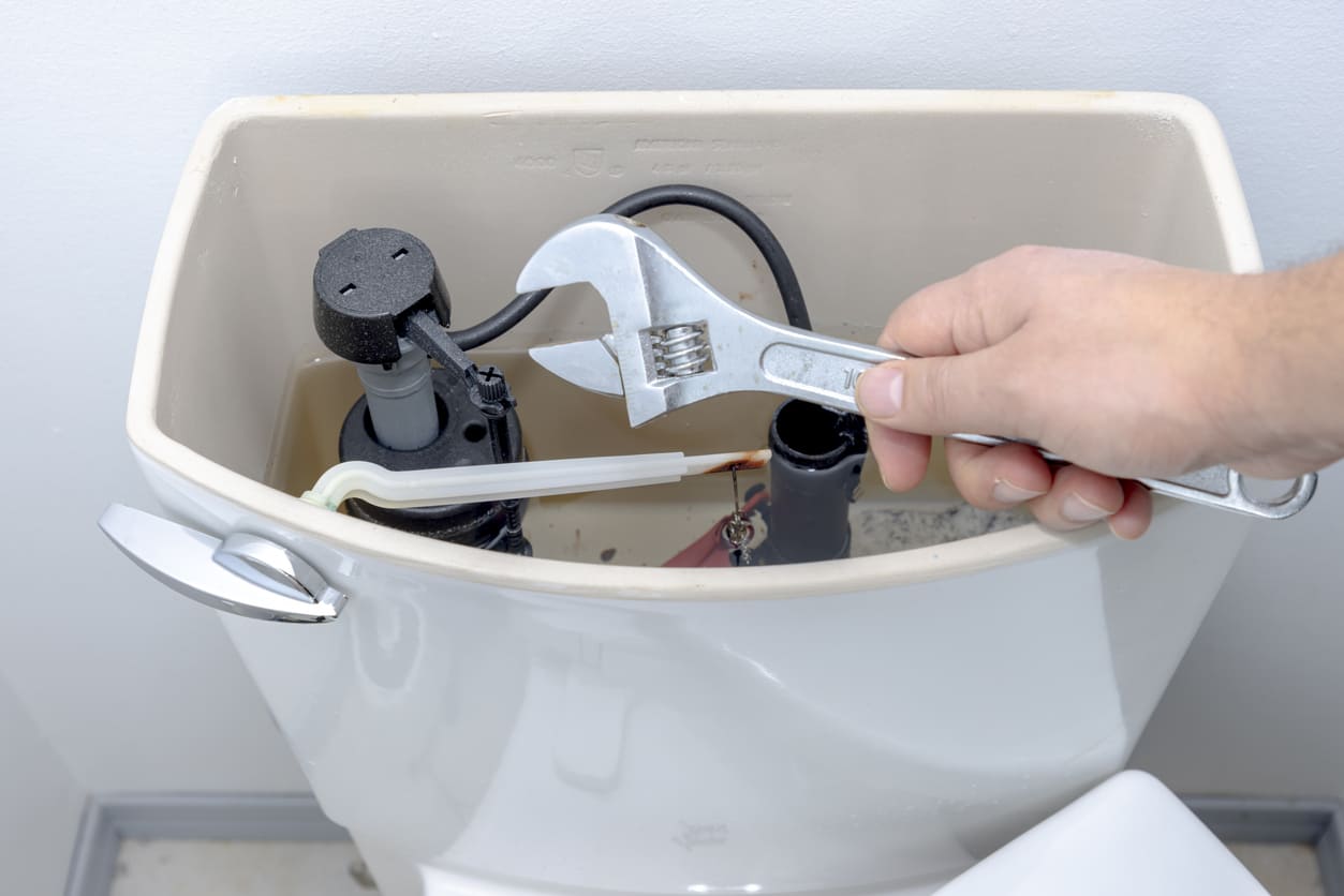 Toilet Tank and Wrench