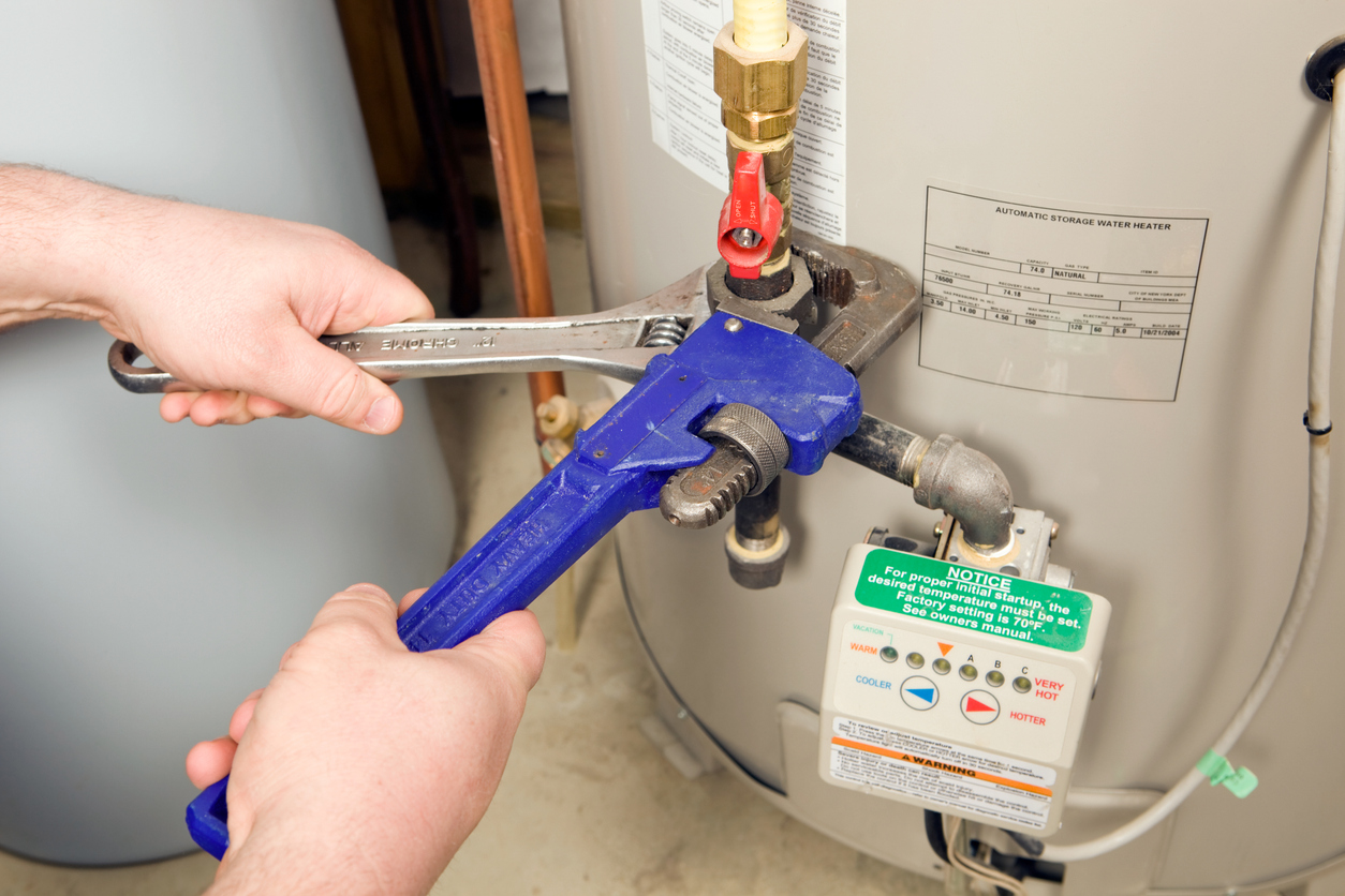 Plumber Fixing Water Heater