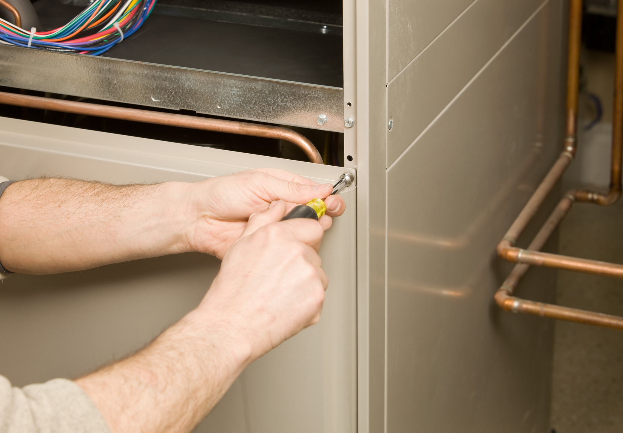 Tech Removing Furnace Panel