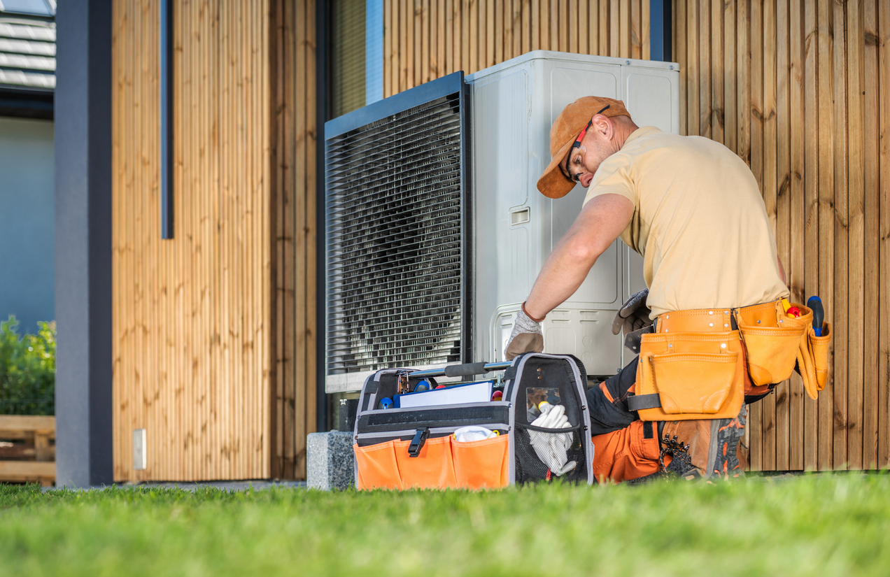 Technician Fixing Heat Pump